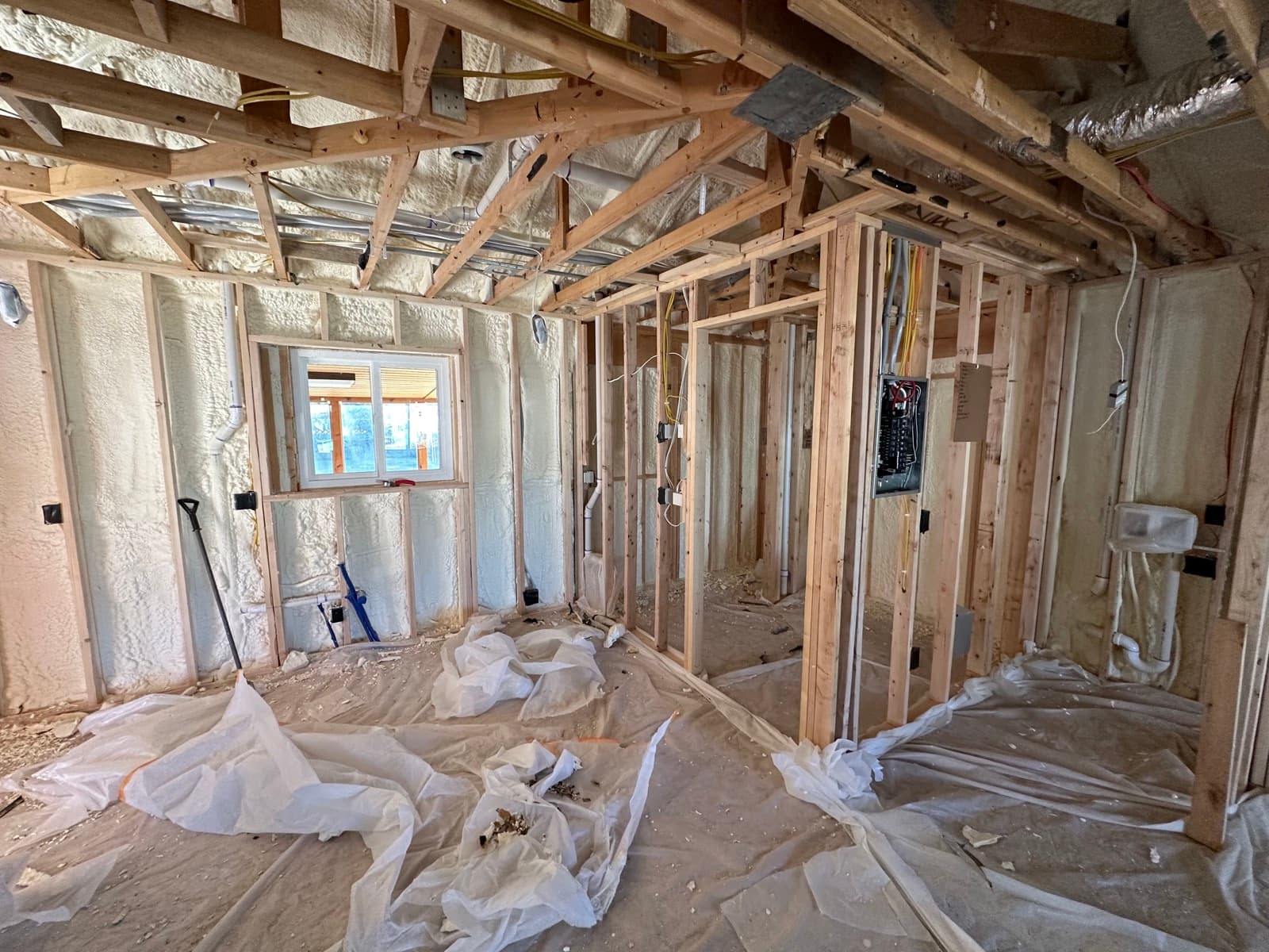 Spray foam insulation installed in the walls and ceiling of a detached ADU